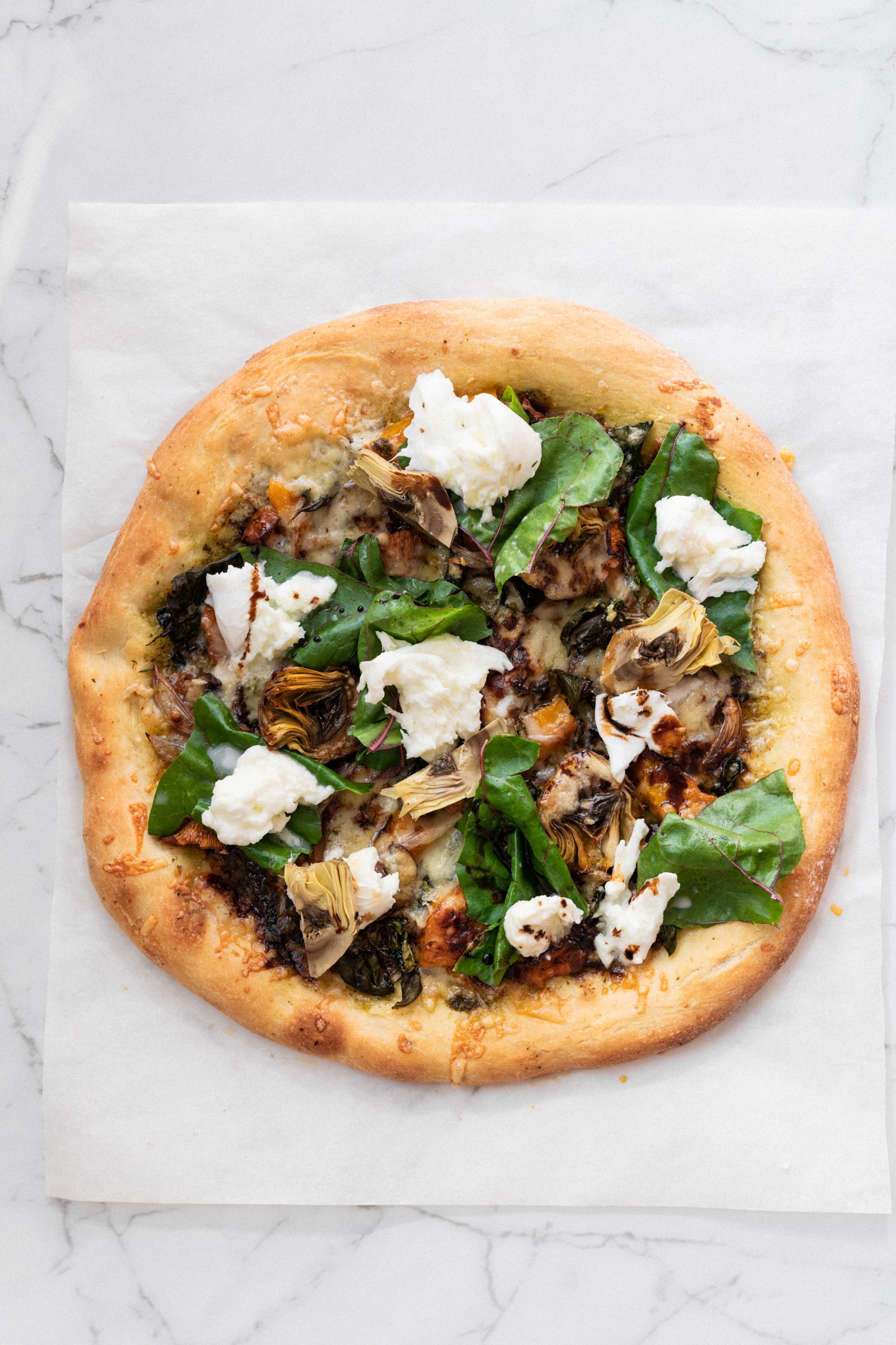 Homemade Pizza With Butternut, Mushrooms, Artichokes And Two Types Of Cheese